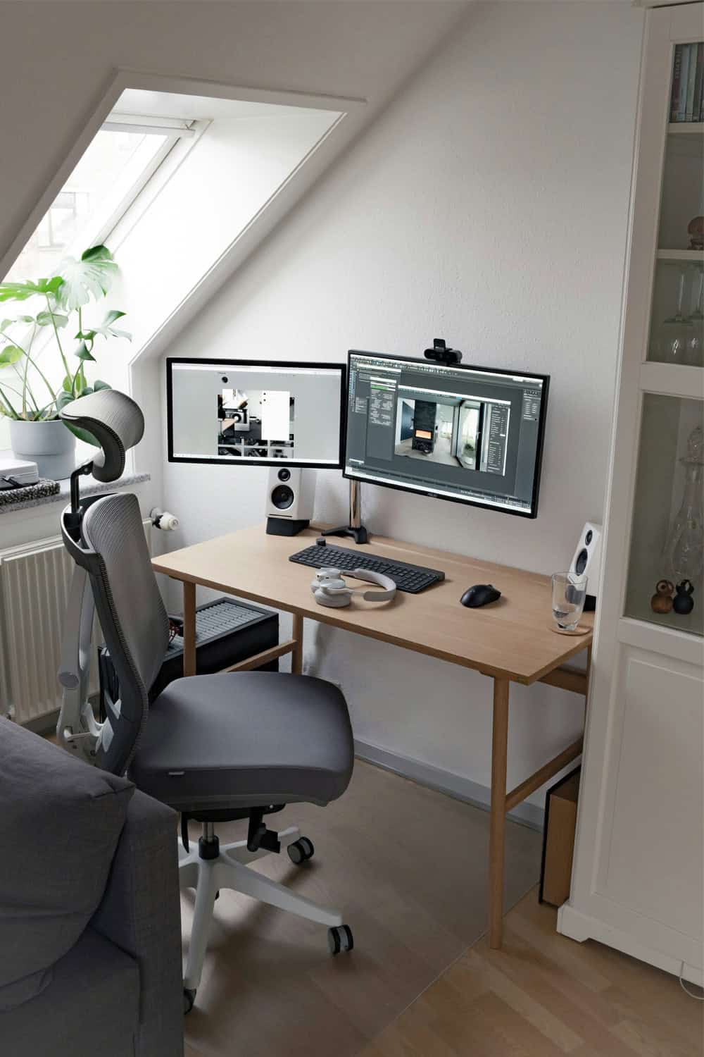 Compact dual monitor setup with monitor arms on a small desk