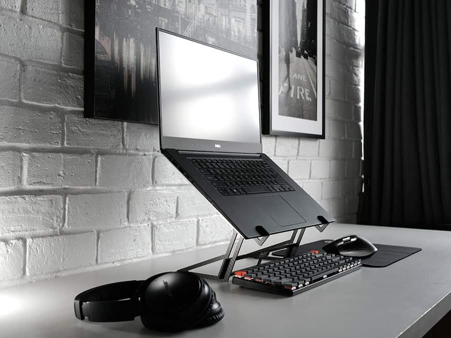 Laptop stand setup on a compact desk for small home office workspaces