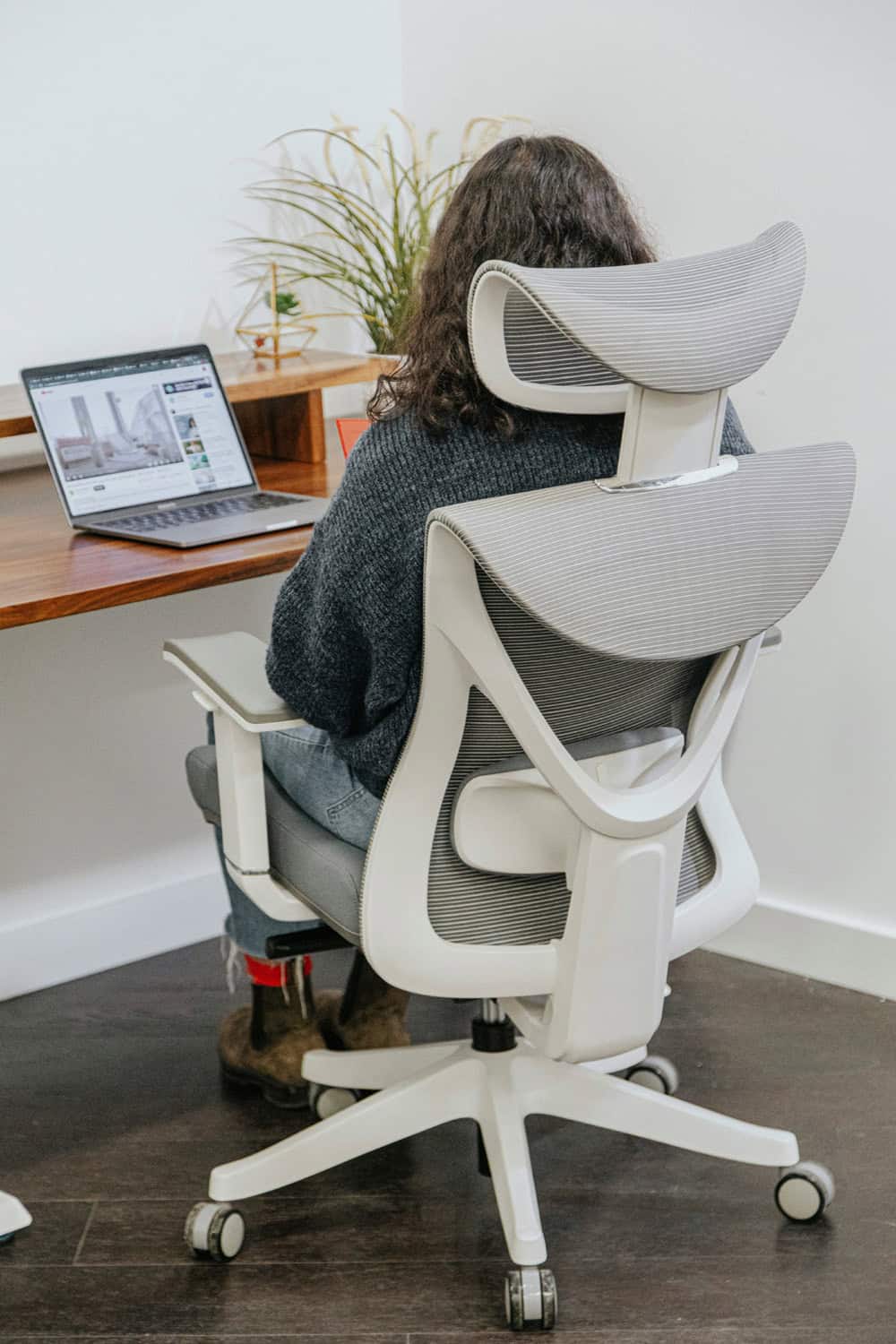 Compact ergonomic office chair in a small home office workspace