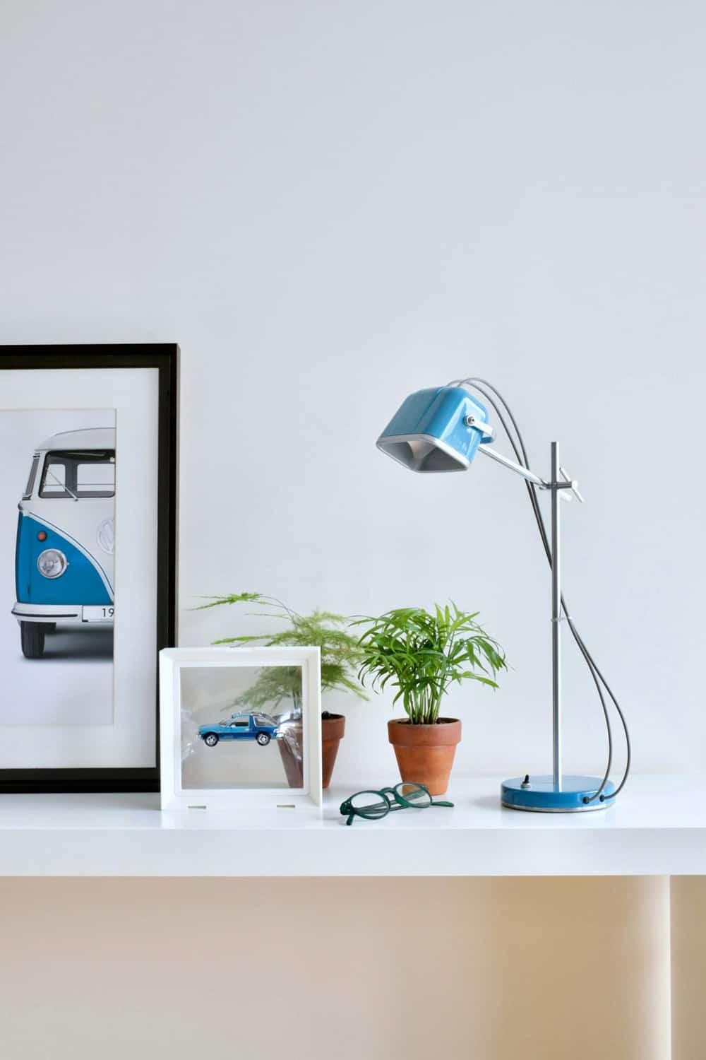 Modern desk lamp on a compact workspace shelf for small home offices